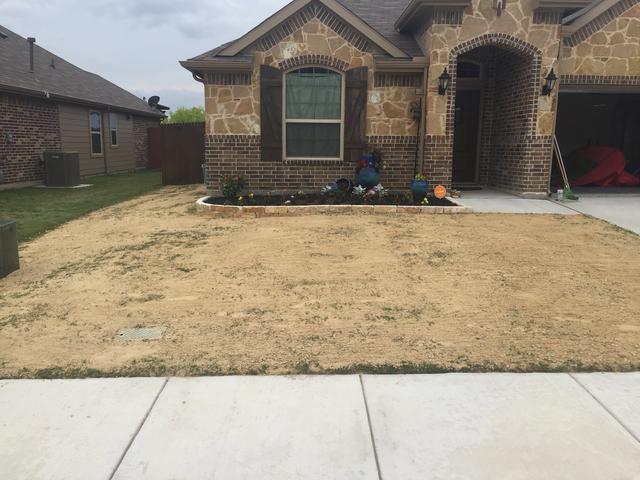 a person driving a lawn mower